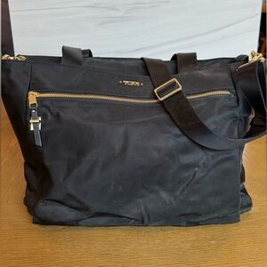 Tumi Black Travel Bag with Gold Accents